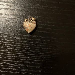 Double sided heart-shaped pendant